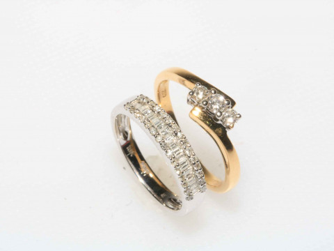 Two 18 carat gold and diamond dress rings.