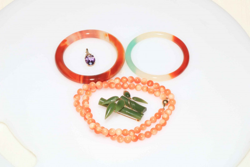 Coral necklace, bangles, brooch and 9 carat gold pendant.