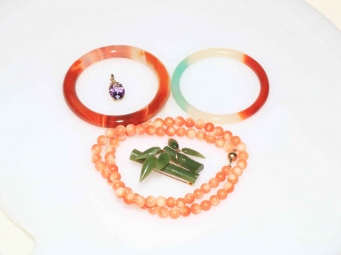 Coral necklace, bangles, brooch and 9 carat gold pendant.