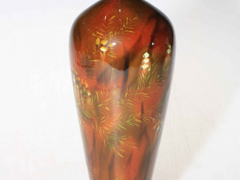Linthorpe Pottery slim bodied vase with floral design on brown ground,...