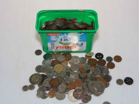 Box of assorted coins and tokens.
