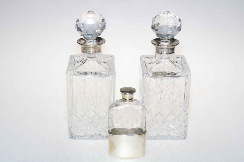 Pair silver collared crystal spirit decanters, Birmingham 1978, together with Victorian silver mounted spirit flask (3).