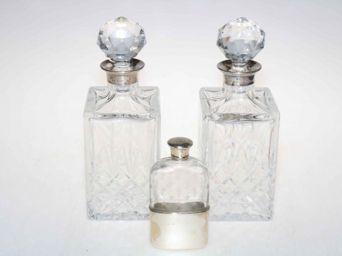 Pair silver collared crystal spirit decanters, Birmingham 1978, together...