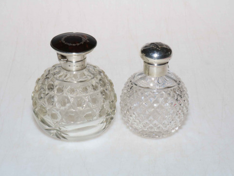 Silver and tortoiseshell topped scent bottle, Birmingham 1925, and another...