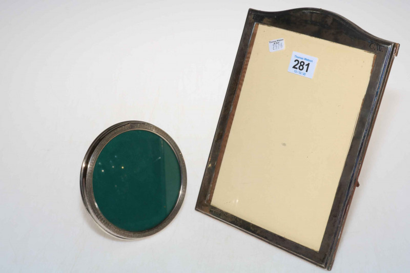 Silver rectangular easel photograph frame, 25cm by 18cm, Birmingham 1918, together with circular silver frame (2).