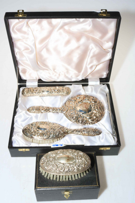 Embossed silver brush and mirror set, and gents hair brush, both boxed (2).