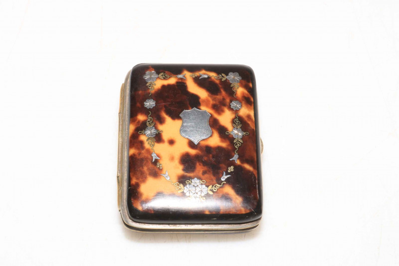 Inlaid with silver tortoiseshell purse.