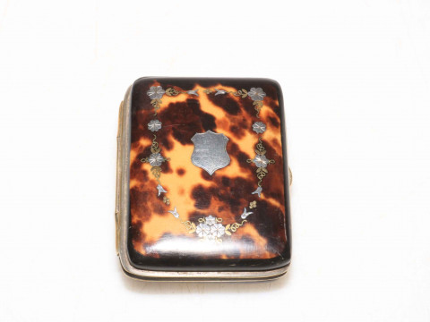 Inlaid with silver tortoiseshell purse.