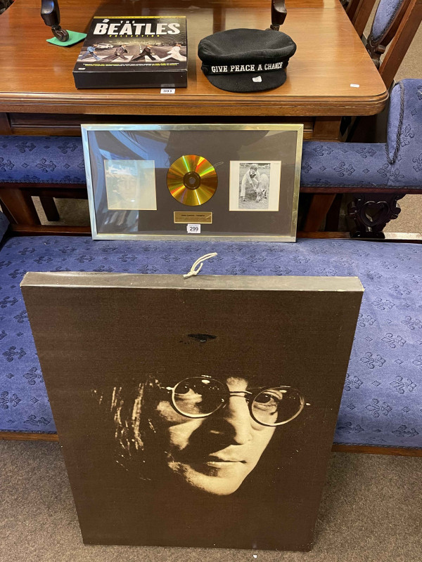 Beatles memorabilia including John Lennon Imagine gold record, canvas, Failsworth beret hat, exclusive DVD and book.