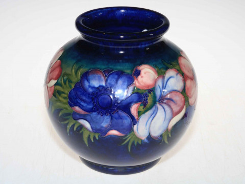 Moorcroft ovoid vase decorated with anemone on blue ground, 22cm high.
