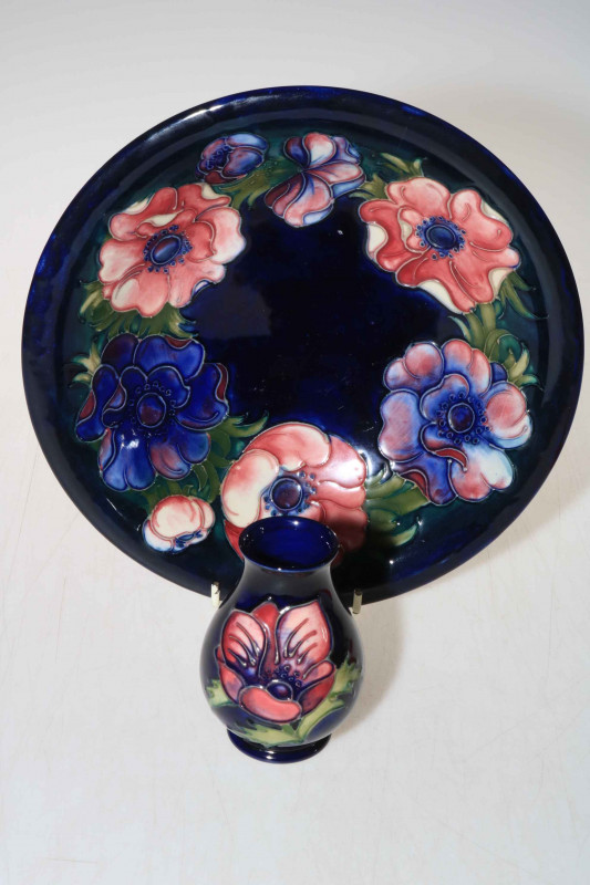 Moorcroft bowl decorated with anemone on blue ground, 25cm diameter, and a small Moorcroft anemone vase on blue ground, 10cm high.