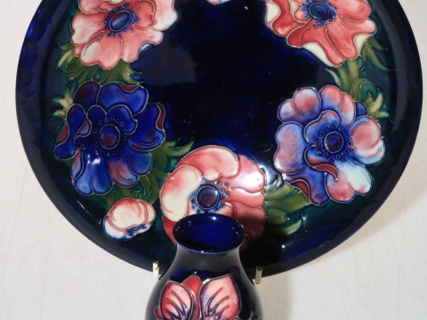 Moorcroft bowl decorated with anemone on blue ground, 25cm diameter, and...