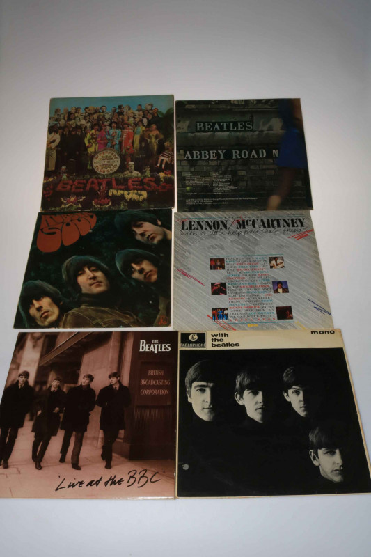 Six Beatles LP's including St. Peppers, Rubber Soul, etc.