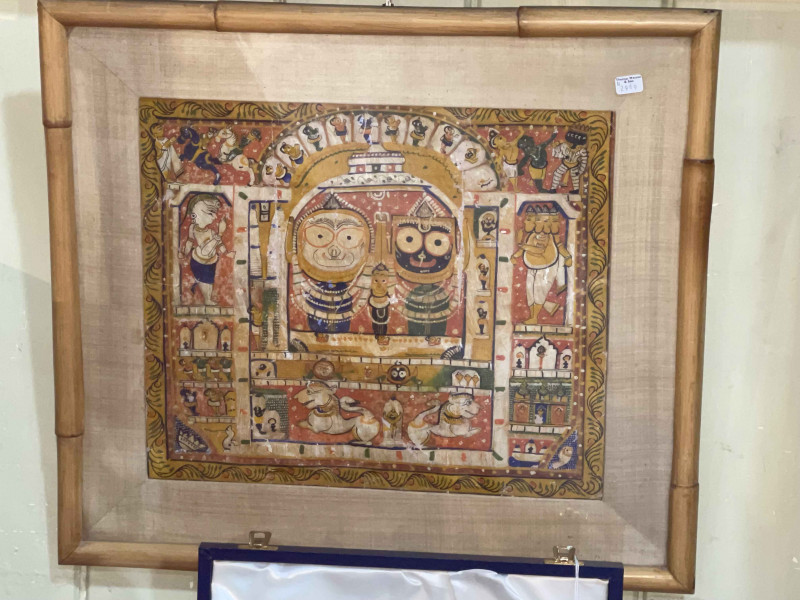 Indian painting of mythical figures, 29cm by 34.5cm, in glazed bamboo frame.