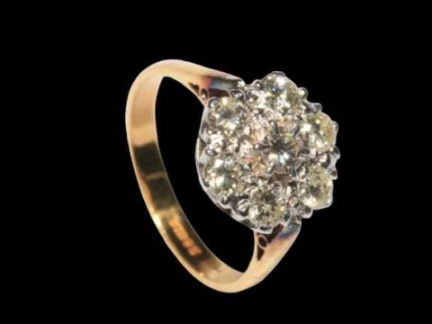 Seven stone diamond petal design ring, the diamonds claw set in white gold to yellow gold shank, size R. thumbnail
