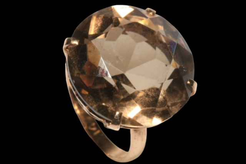 Large brilliant cut smokey quartz ring in claw set 14 carat gold, size K.