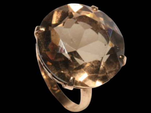Large brilliant cut smokey quartz ring in claw set 14 carat gold, size K. thumbnail
