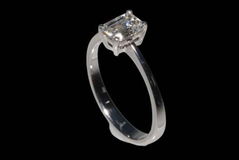 Emerald cut solitaire diamond ring set in 18 carat white gold, diamonds approx 0.80 carats with certificate, size Lœ.