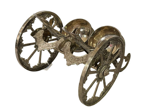Silver plated double wine bottle chariot, 29cm across.