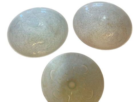 Three Celadon bowls, largest 20cm diameter. thumbnail
