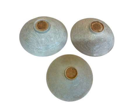Three Celadon bowls, largest 20cm diameter. thumbnail