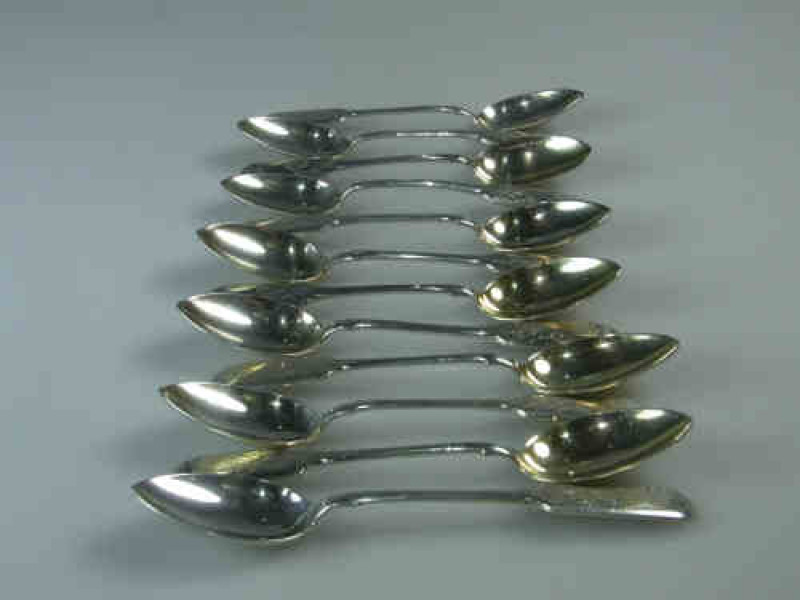 Set of Twelve Russian Silver Teaspoons, 84 Zolotnik Standard, engraved with foliage and vacant cartouches, 12.4 Troy oz.