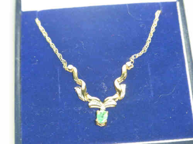 Emerald and Six Stone Diamond and 9ct Gold Pendant, with Chain
