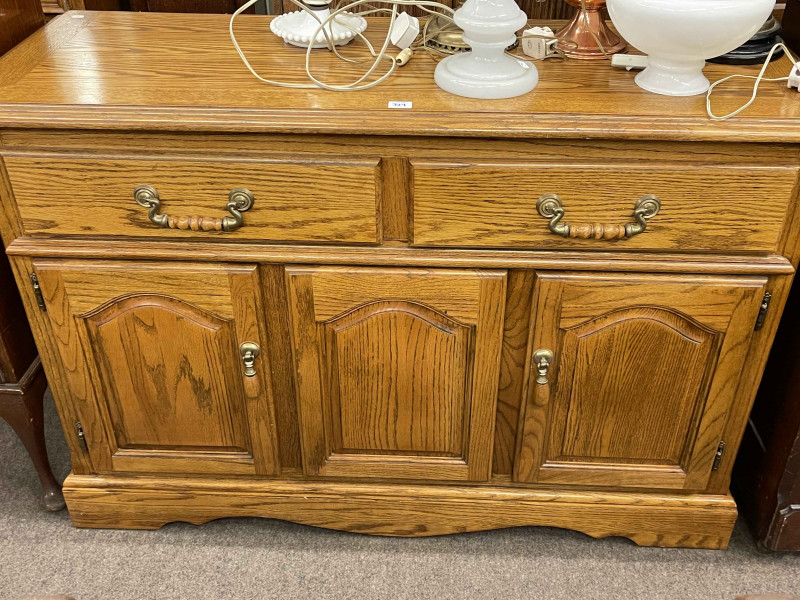 Old Charm carved oak two door cabinet, two drawer console table and oak finish three door sideboard (3).