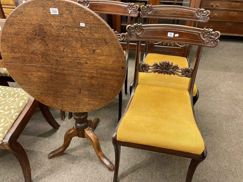 Victorian carved oak snap top supper table and set of three 19th Century mahogany sabre leg dining chairs (4).