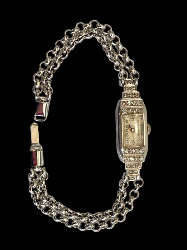 Diamond set platinum cocktail watch with 9 carat white gold bracelet.