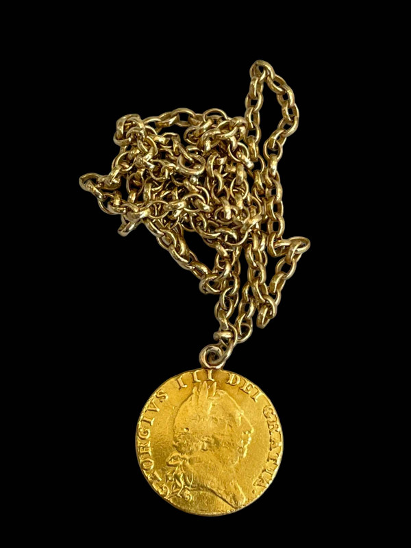 George III gold guinea 1787 on 9 carat gold chain, 60cm length.