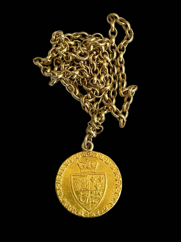 George III gold guinea 1787 on 9 carat gold chain, 60cm length.