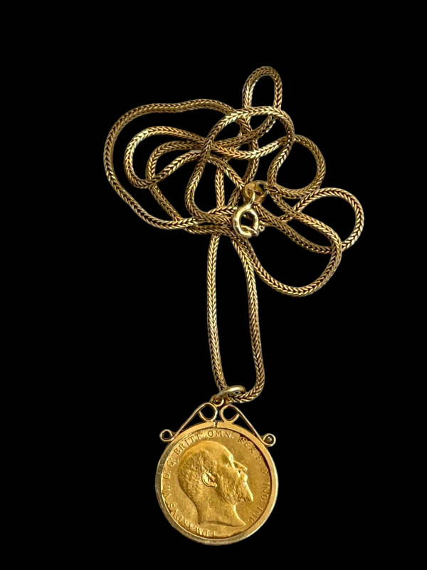 Edward VII gold sovereign, 1903, in mount and with 9 carat gold chain, 52cm length.