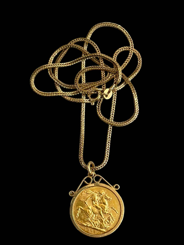 Edward VII gold sovereign, 1903, in mount and with 9 carat gold chain, 52cm length.