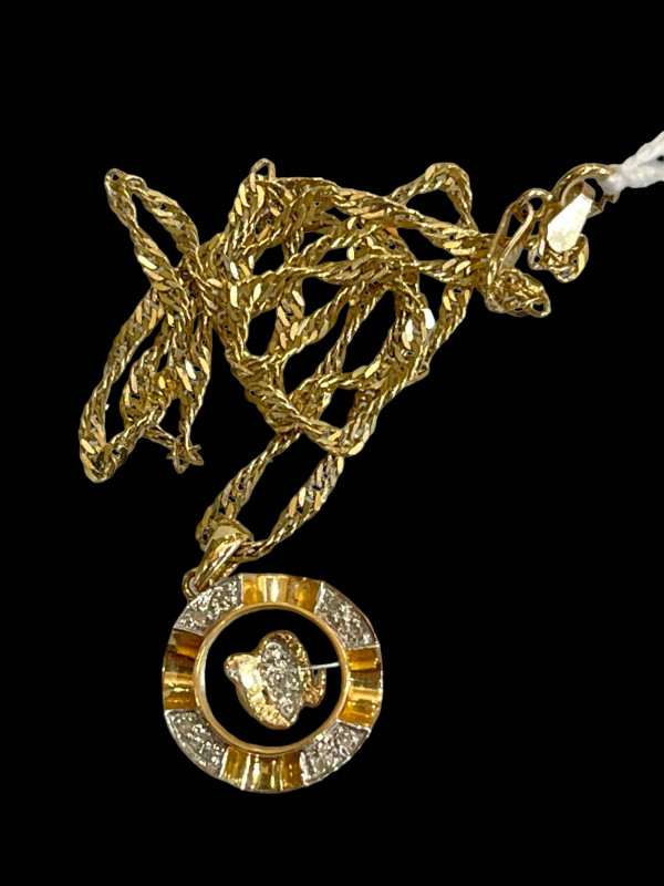 18 carat gold pendant with 9 carat gold chain.