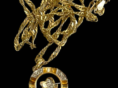 18 carat gold pendant with 9 carat gold chain.