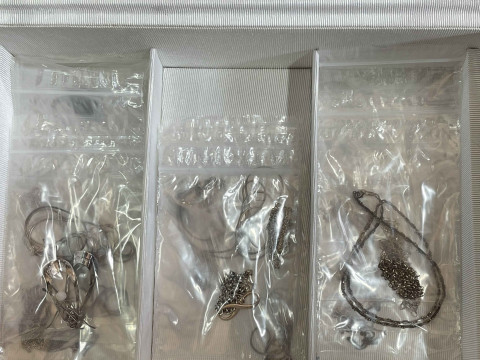 Jewellery box with many pieces of silver jewellery. thumbnail