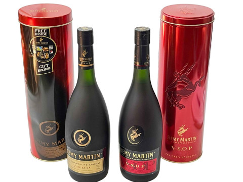 Two bottles of Remy Martin VSOP brandy, both tined.