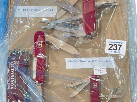 Three Swiss Army knives.