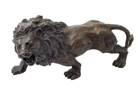 Hollow bronze/spelter lion, 29cm length.