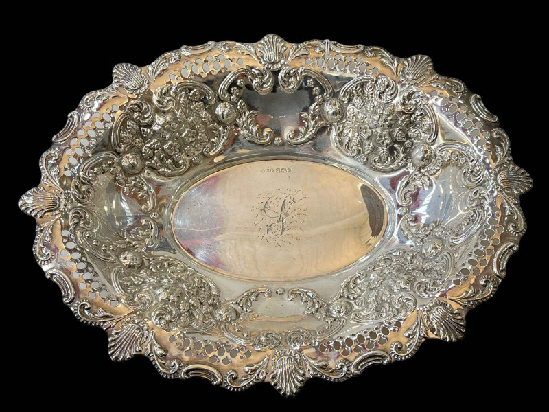 Edwardian silver basket, pierced and embossed, Sheffield 1908, 31cm across.