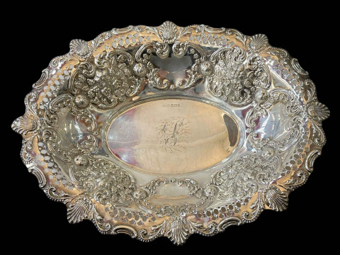 Edwardian silver basket, pierced and embossed, Sheffield 1908, 31cm across.