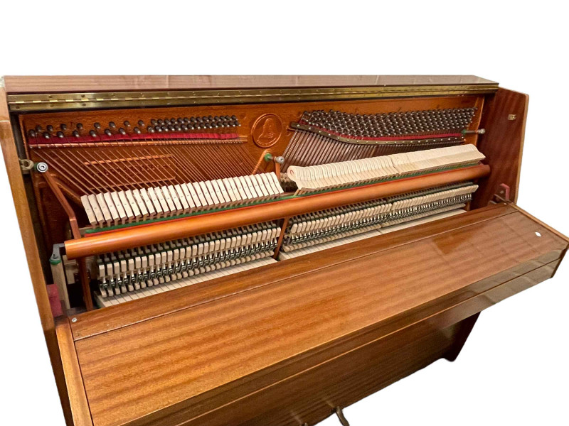 1980's John Broadwood & Sons mahogany upright overstrung piano, 109cm by 142cm by 22cm.