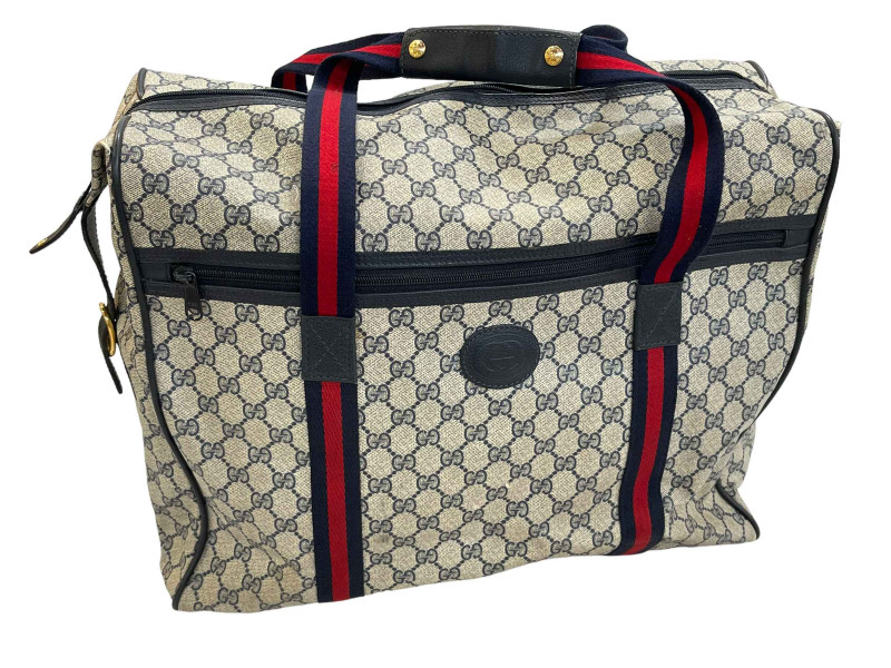 Gucci Grey Supreme monogrammed holdall bag.