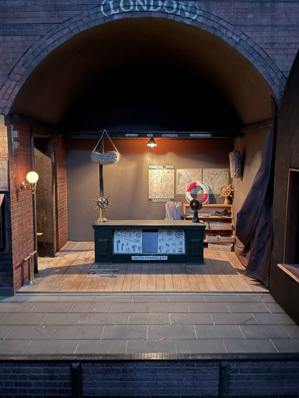 Steve Hilbert, miniature model of a boathouse, with electric lights.