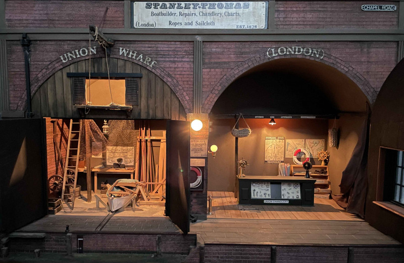 Steve Hilbert, miniature model of a boathouse, with electric lights.