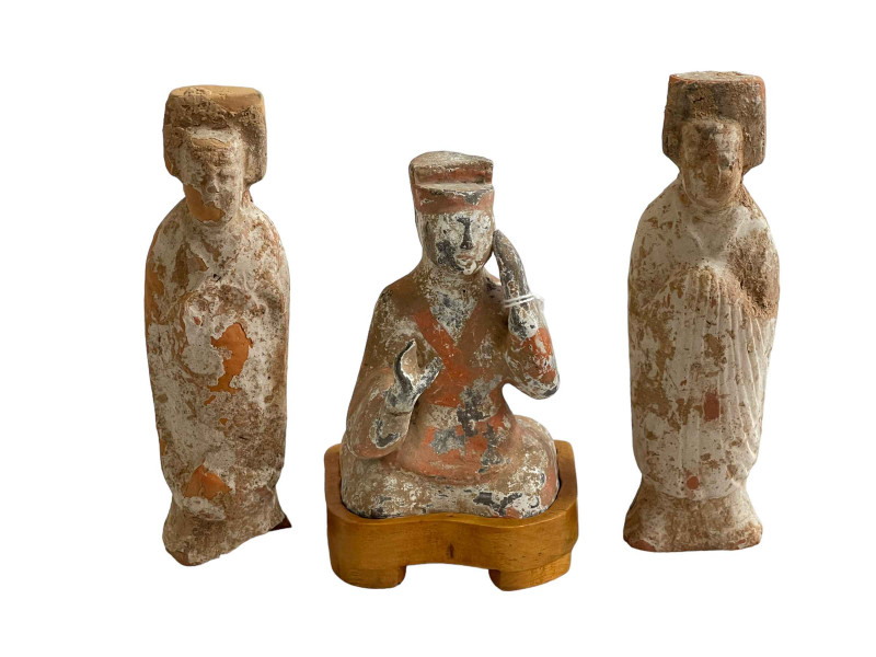Three Chinese clay figures.