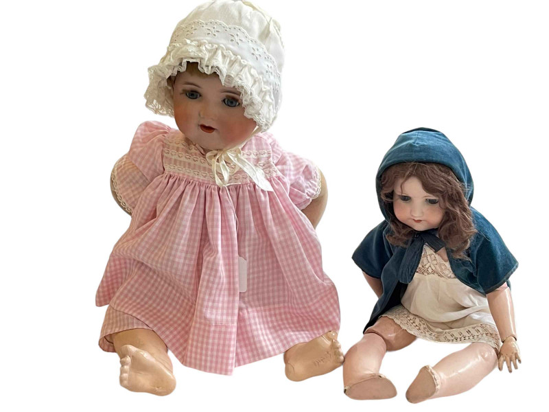 Two Armand Marseille bisque head dolls.