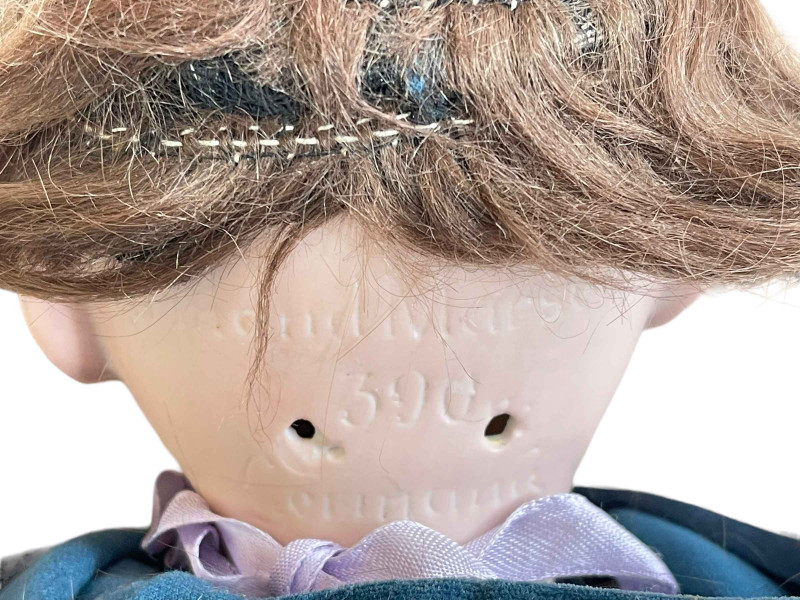 Two Armand Marseille bisque head dolls.