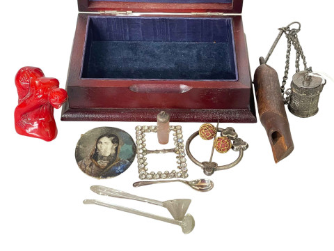 Embossed silver lidded box with miscellaneous contents.